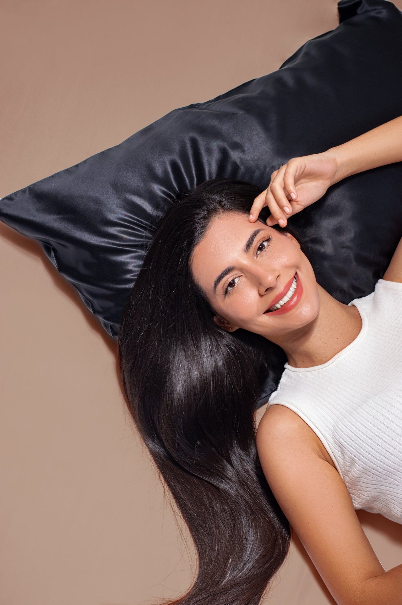 black-silk-pillowcase-with-smiling-woman-and-beautiful-skin-and-hair.jpeg